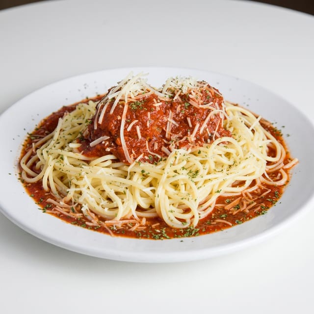 Meatball Parmesan Over Spaghetti.